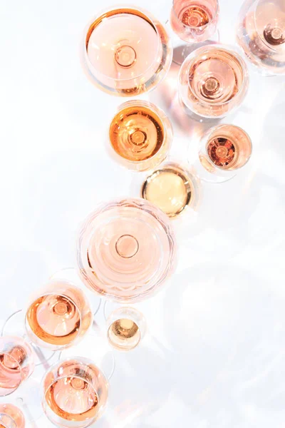 Many glasses of rose wine at wine tasting. Concept of rose wine