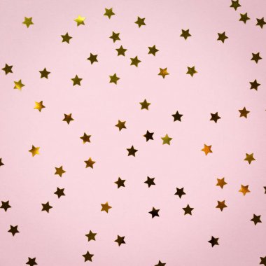 Pembe üzerinde altın yıldız sprinkles. Şenlikli tatil arka plan. Celeb