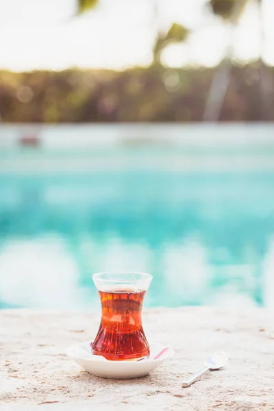 Hot turkish tea outdoors near water. Turkish tea and traditional