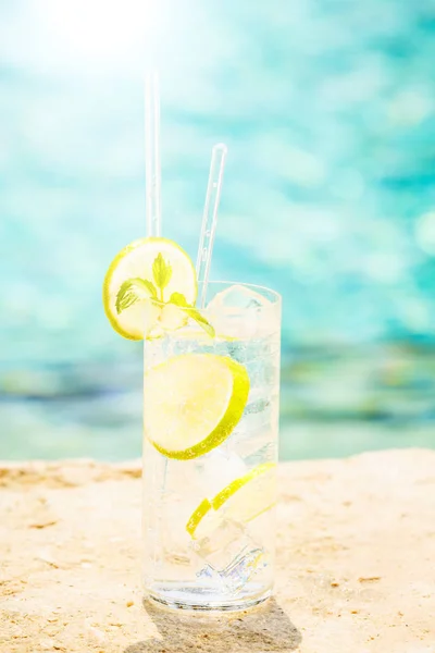 Water with ice at the edge of a resort pool. Concept of luxury v