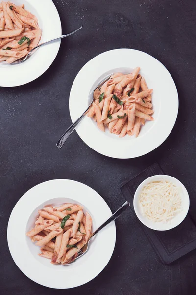 Three plates of penne alla vodka — Stock Photo, Image