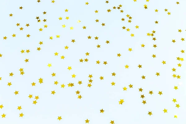 A estrela dourada polvilha no azul. Fundo festivo de férias. Celeb. — Fotografia de Stock