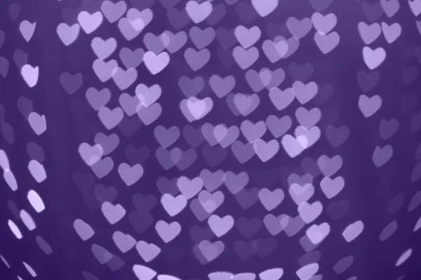 Forma do coração desfocado fundo bokeh com brilhos. Ultra violeta — Fotografia de Stock
