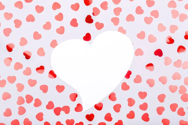 White heart with glitter heart confetti. Valentine day concept. — Stock Photo, Image