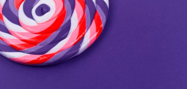 Big lollipop on solid ultra violet background — Stock Photo, Image