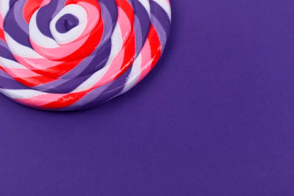 Big lollipop on solid ultra violet background — Stock Photo, Image