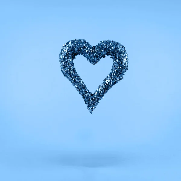 Glitter heart on classic blue background. Valentines day and love concept . — Stock Photo, Image