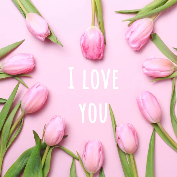 I love you wording with pink tulips on the pink background. Flat lay, top view. Valentines background. — 스톡 사진