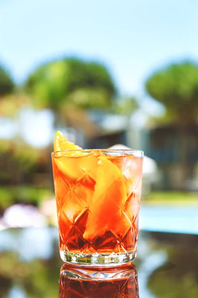 Negroni cocktail at the resort bar or suite patio. Luxury resort, vacation, room service concept — Stock Photo, Image