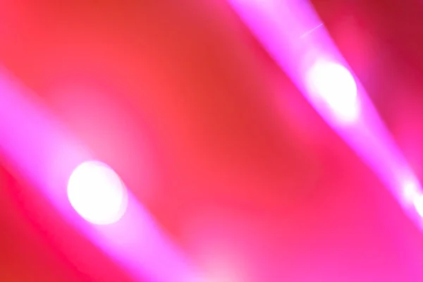 Futuristické rozmazané neonové kapky v červené a růžové barvě — Stock fotografie