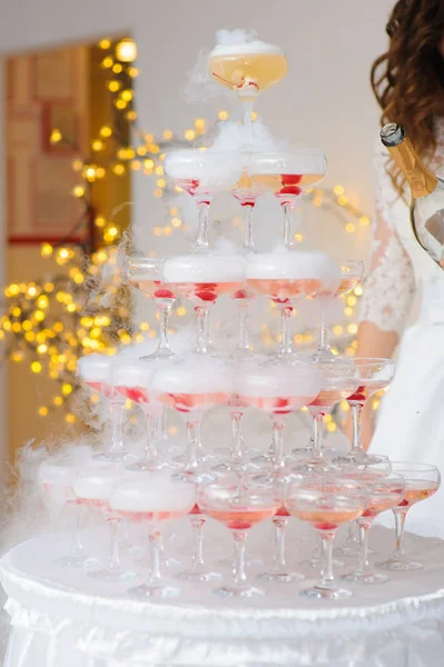 A pyramid of champagne glasses with a cherry — Stock Photo, Image