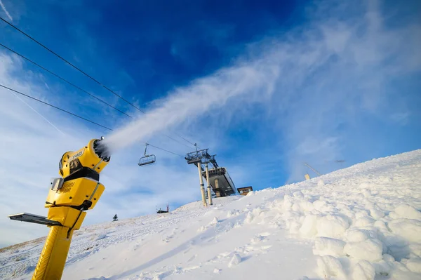 Snow cannon in action at ski resort — Stock Photo, Image