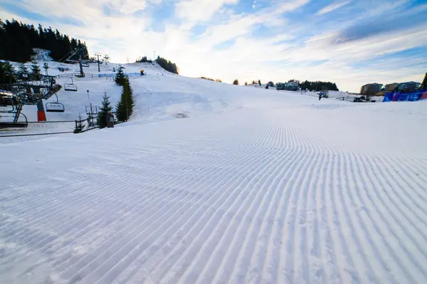 Skiing background - fresh snow on ski slope — Stock Photo, Image