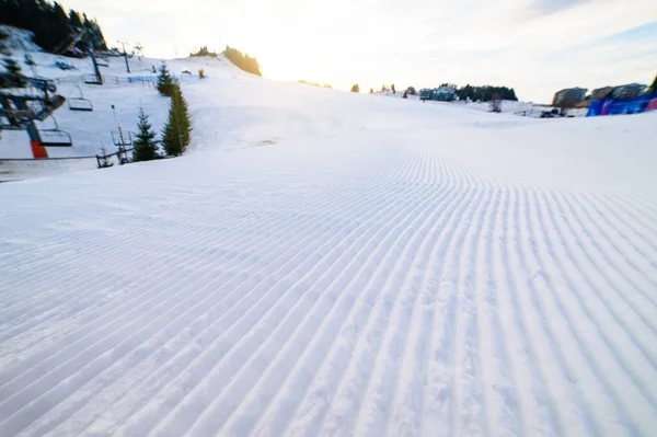 Skiing background - fresh snow on ski slope — Stock Photo, Image