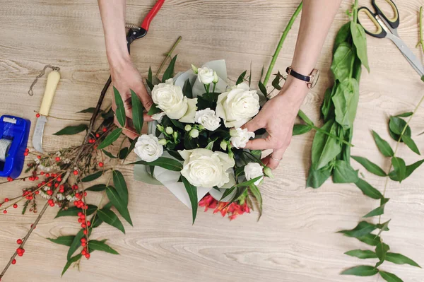 Stock image Gardener's in the flower shop make bouquet. Lifestyle flower sho