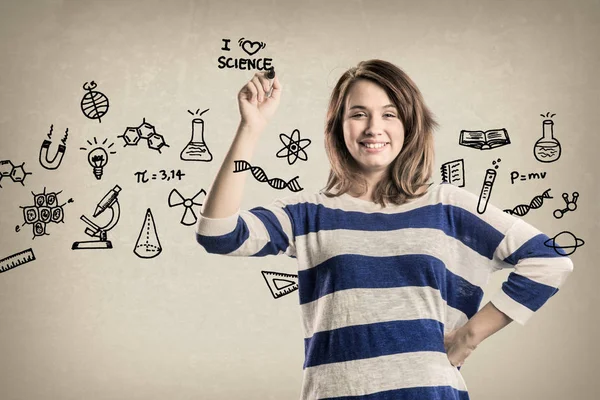 Garota adolescente sorridente, com doodles de ciência — Fotografia de Stock