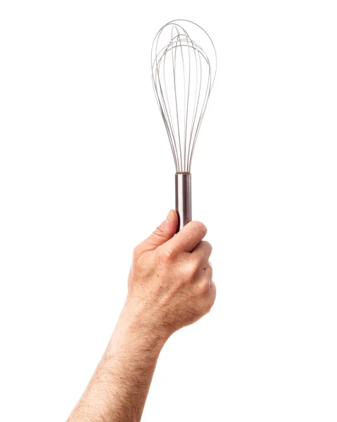 Sola mano humana sosteniendo herramientas de cocina: alambre Wisk, aislado sobre fondo blanco —  Fotos de Stock
