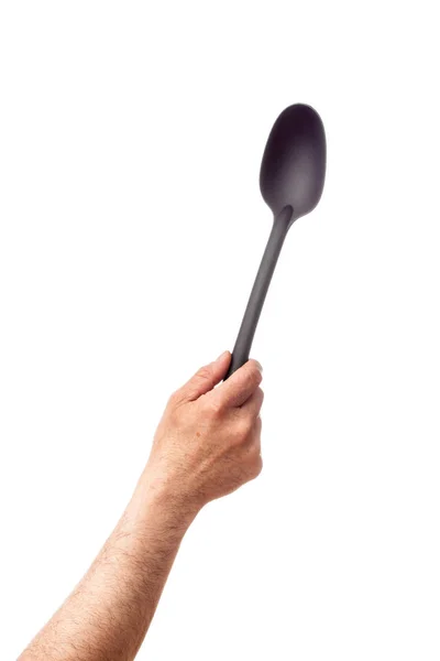 Singola mano umana in possesso di utensili da cucina: cucchiaio server, isolato su sfondo bianco — Foto Stock