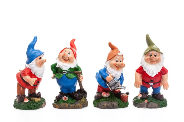 Four Garden Gnomes isolated on white background, simple figurines to decorate your garden — Stock Photo, Image