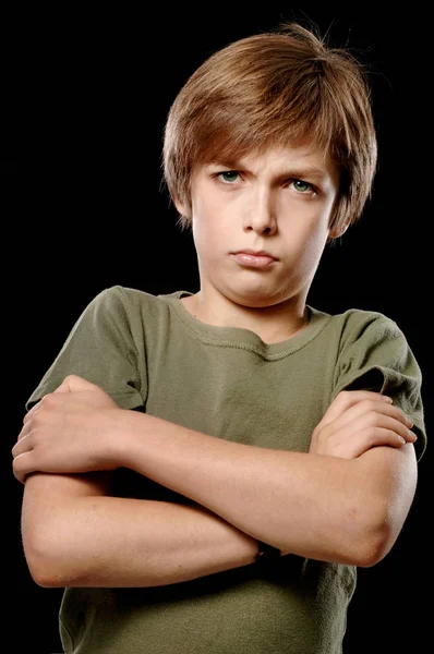 Série Expressões: Menino da escola isolado no fundo preto: Irritado / Sulking — Fotografia de Stock