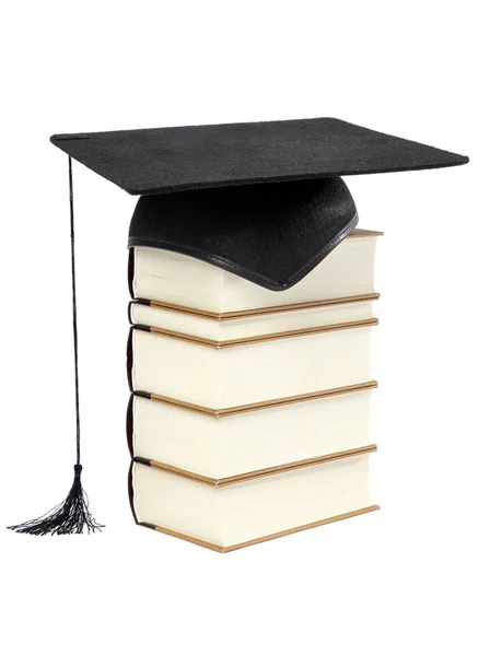 Avläggande av examen Cap på trave böcker isolerad på vit bakgrund — Stockfoto