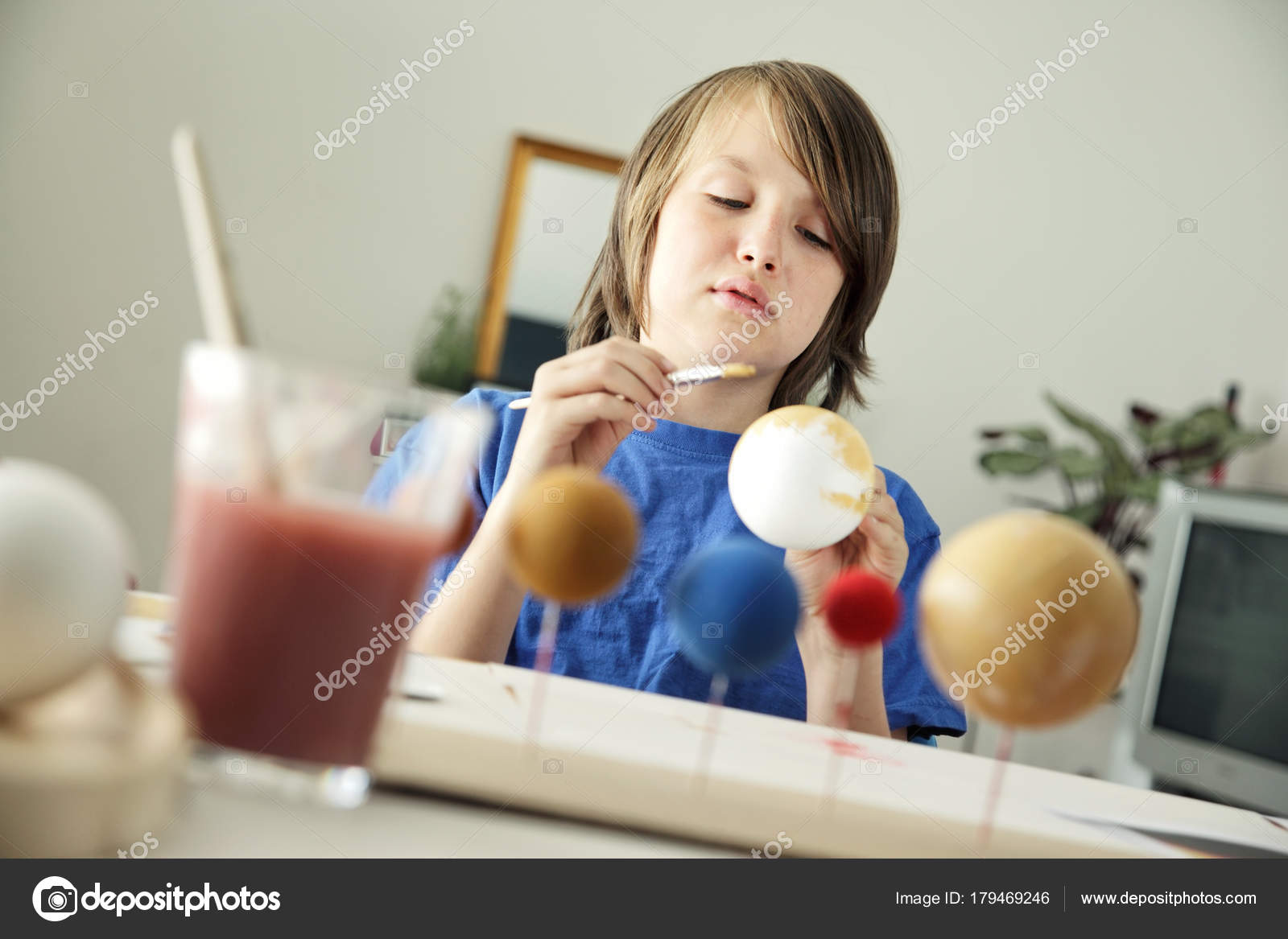 Happy School Boy Making A Solar System For A School Science