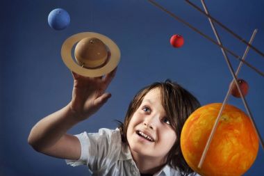 Kids and Science, self made Solar System Project - Studio shots with Young happy Boy clipart