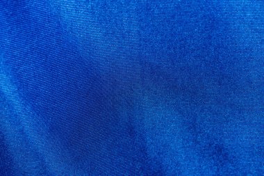 Close-up detailed bright dark blue fabrics textile texture background