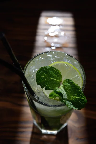 cocktail with ice, mint and lime. top view.