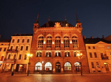 Artus Court (Dwor Artusa) at Market square in Torun.  Poland clipart