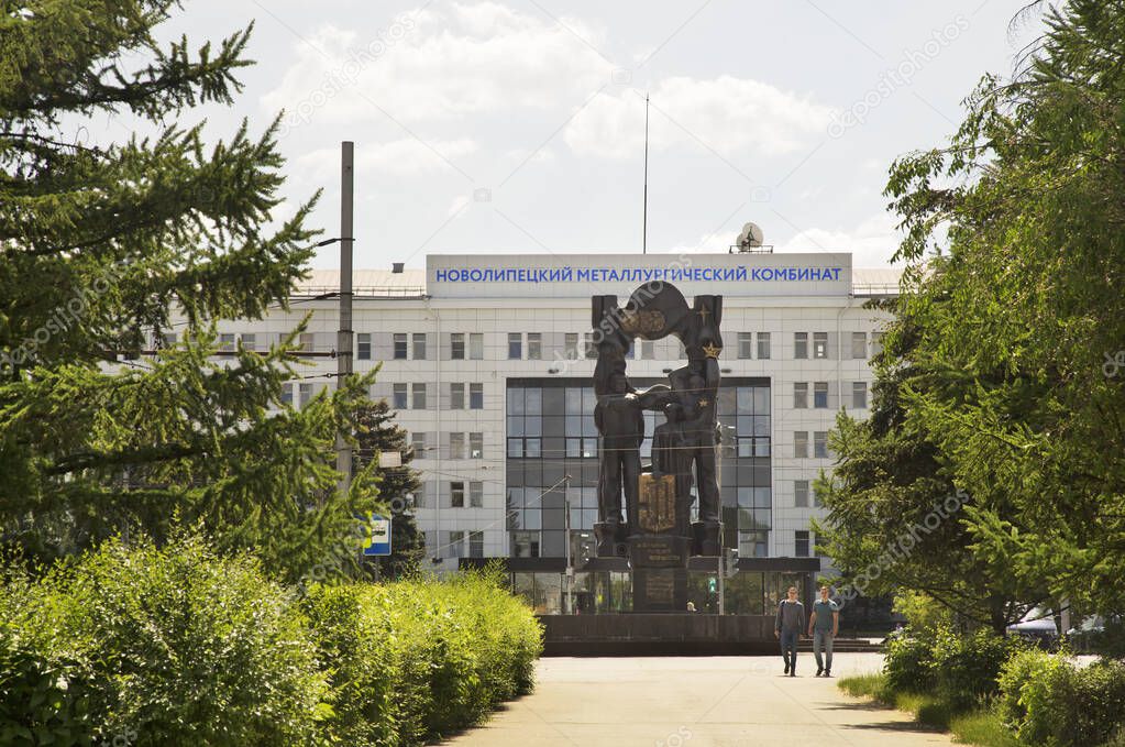 Monument 50 years NLMK and Main administrative building of Novolipetsk metallurgical combine in Lipetsk. Russia