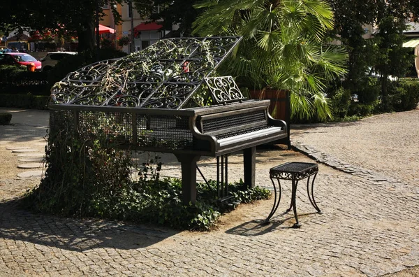 Metal grand piano at Music garden in Kudowa-Zdroj. Poland
