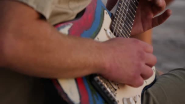 Hands of musician playing an electric guitar. Close up of sound making — Stock Video