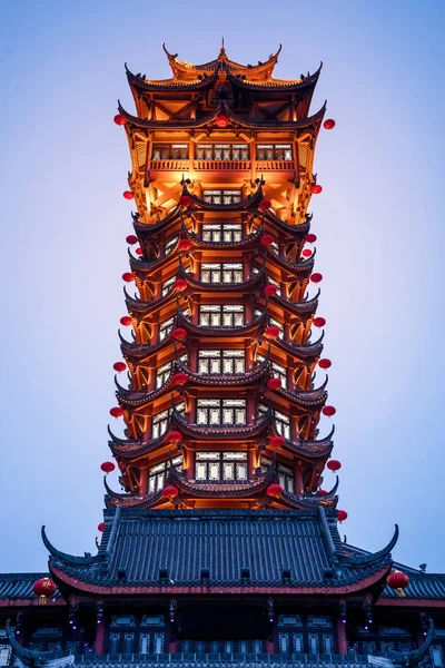Beautiful Chinese tower at night time.(red ball translation: Celebrating the Spring Festival)