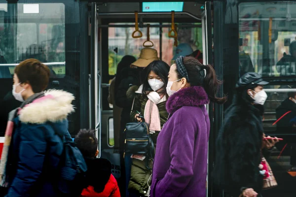 CHINA,CHENGDU,Yinghui Rd.-JANUARY 23,2020: Coronavirus epidemic in China .People wearing face masks.