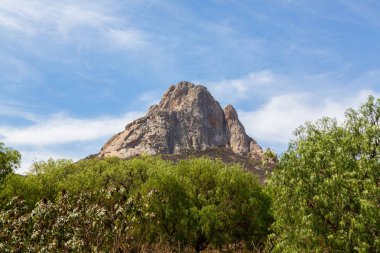 The rock of Pena de Bernal. clipart