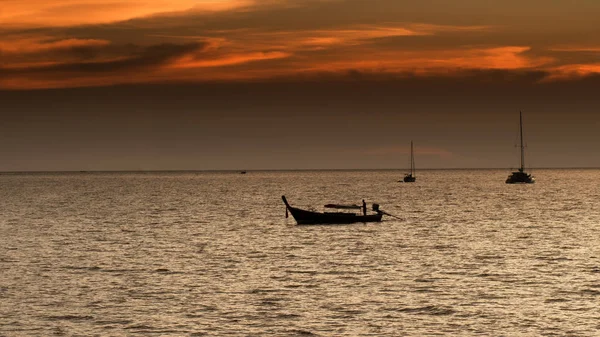 Fisherman boat silhouette on sunset time. — Stock Photo, Image