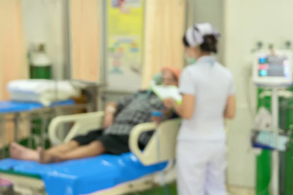 Verschwommene Krankenschwester in Notaufnahme wegen medizinischen Hintergrunds — Stockfoto