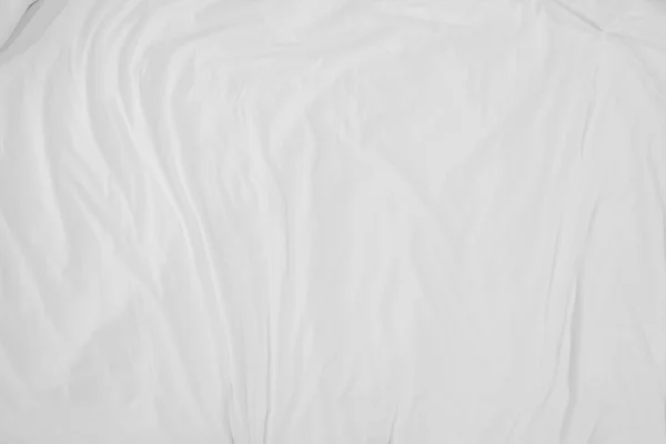 Top view of bedding sheets crease,white fabric wrinkled texture