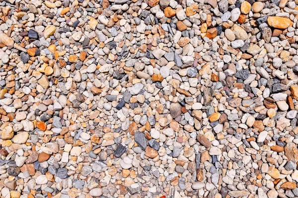 小さな小石の海の背景。公園内の自然の床 — ストック写真