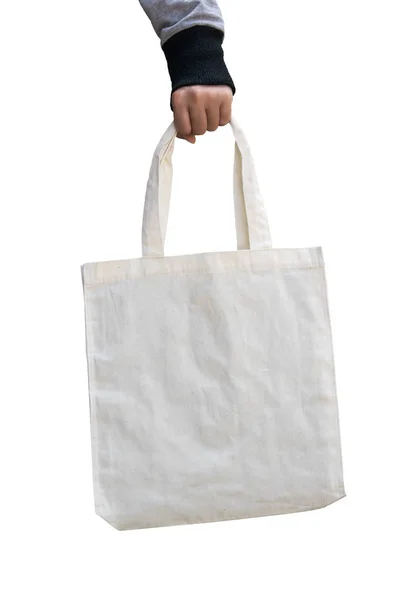 Femme main tenant sac en tissu de coton blanc sur isolé, sauver concept du monde — Photo