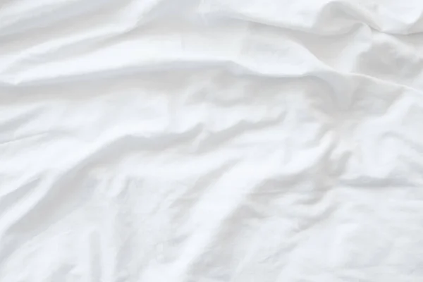 Wit beddengoed, lakens of witte stof rimpel textuur achtergrond, soft focus Sea... — Stockfoto