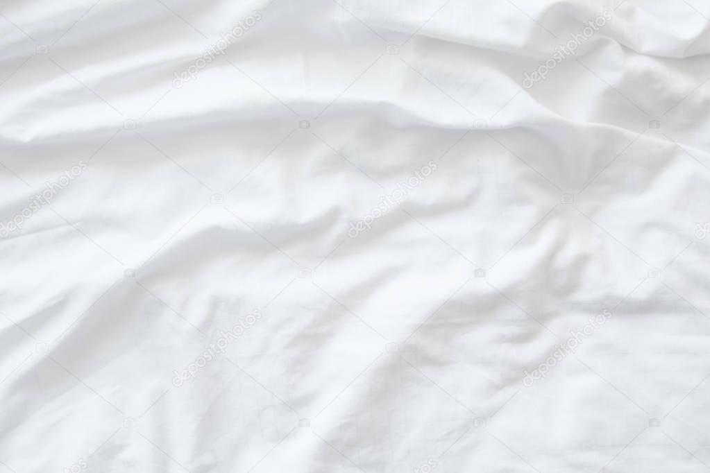 White bedding sheets or white fabric wrinkle texture background,soft