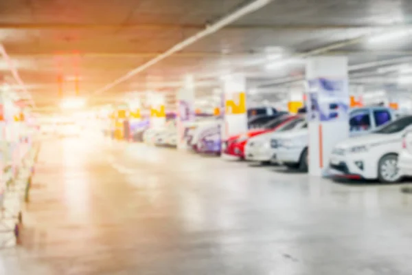 Blurred of many cars in parking garage interior public building for background — Stock Photo, Image