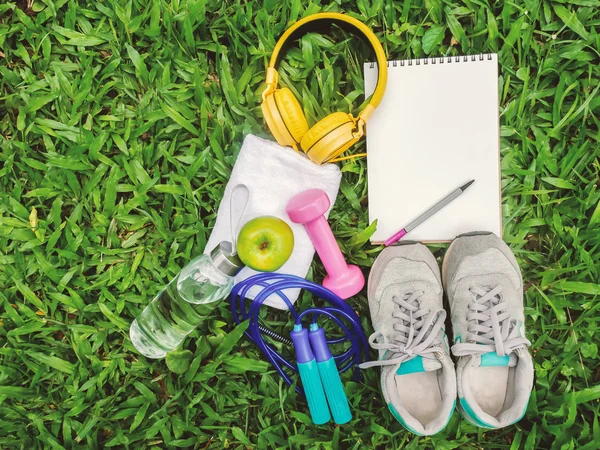 Sports Equipment on green grass with copy space on left for Presentations and Web Design. A Lot of Space for Text Composition art image, website, magazine or graphic for commercial fitness design — Stock Photo, Image