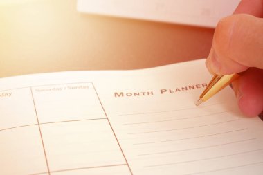 Boş planlama defter masanın üstüne yazma el bize organizer programı yaşam ya da iş planlayıcısı kavram kullanmak