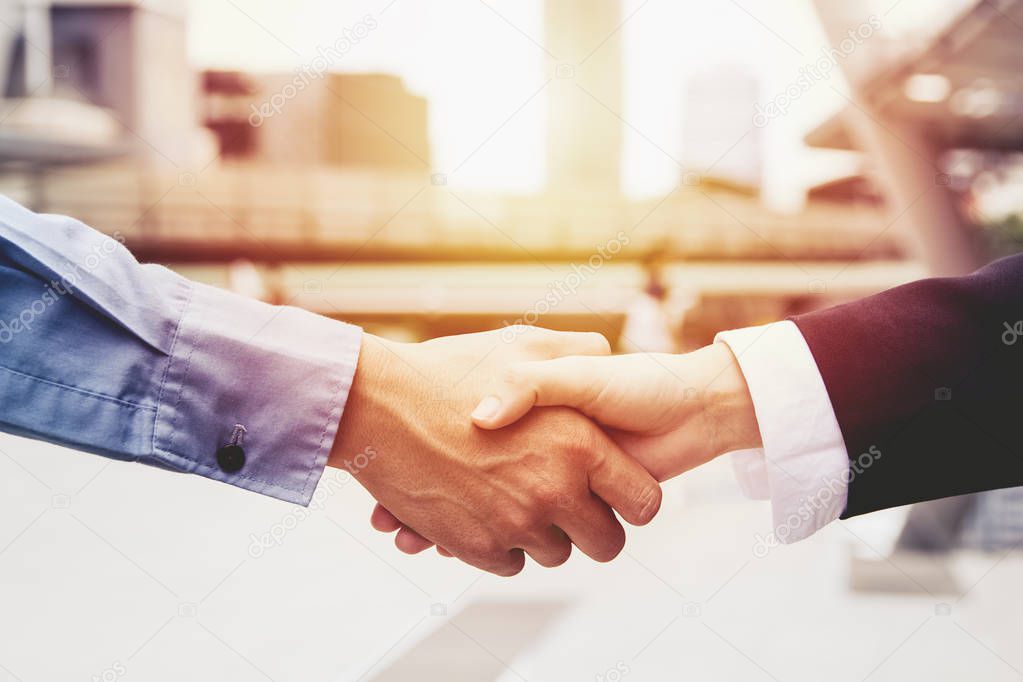 successful business people handshaking closing a deal ,business team partnership concept