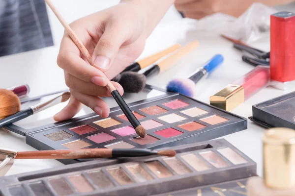 Makeup artist hand using brushes powder foundation and tools of make up artist accessory — Stock Photo, Image