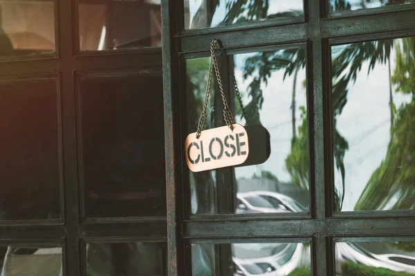 Close sign in a shop door concept for The store closes — Stock Photo, Image