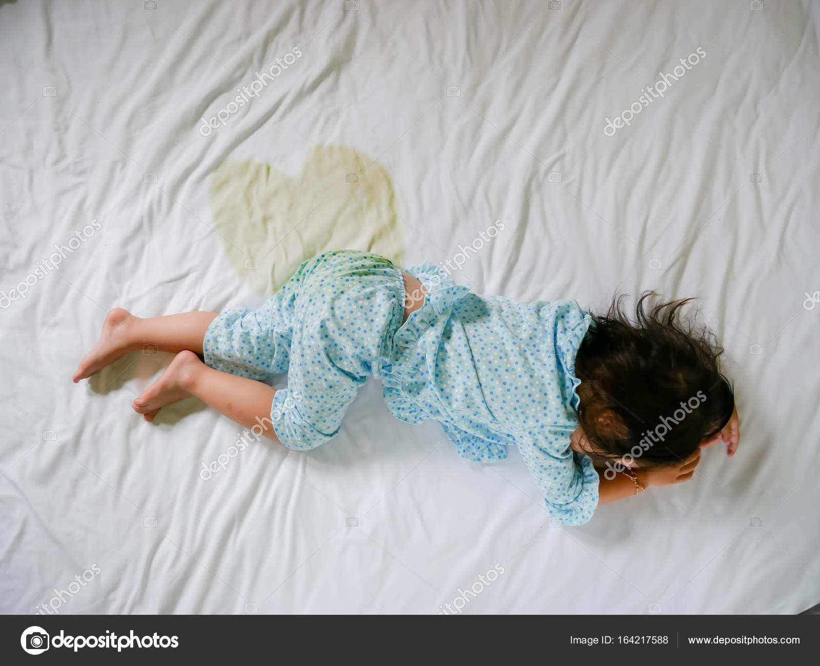 Bedwetting Child Pee On A Mattress Little Girl Feet And Pee In Bed Sheet Child Development Concept Selected Focus At Wet On The Bed Stock Photo Image By C Jes2uphoto
